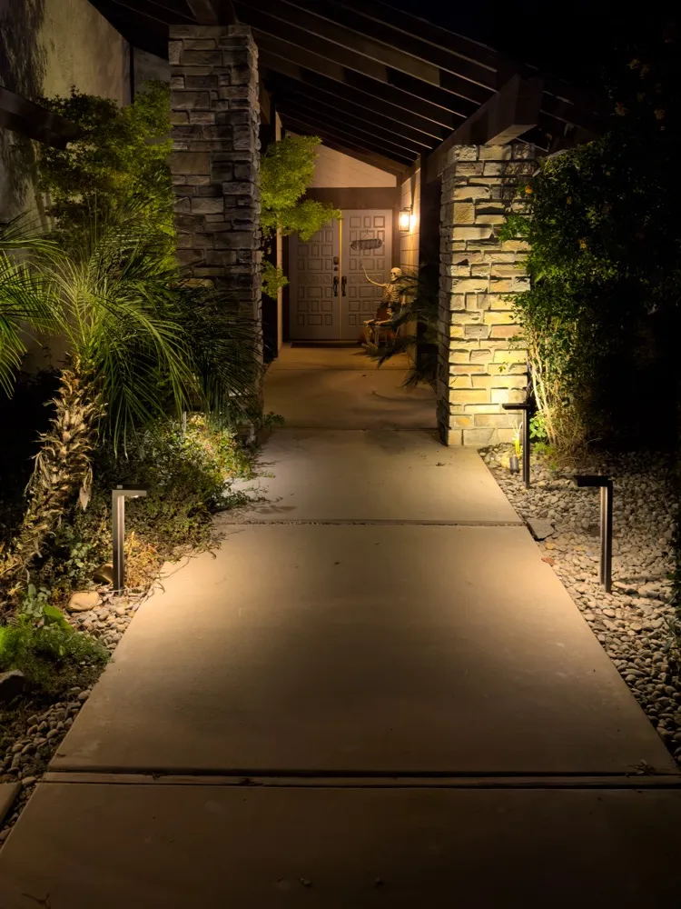 Walkway lighting along a front path at night